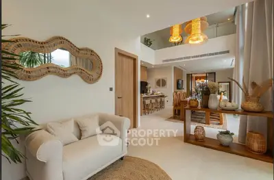 Luxurious open-plan living and dining area with elegant decor and natural light.