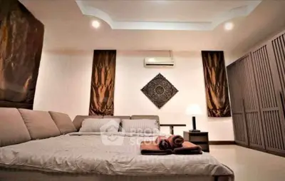 Luxurious bedroom with elegant decor and ambient lighting