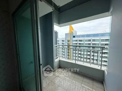 Spacious balcony with city view in modern high-rise apartment