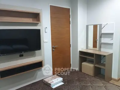 Modern bedroom with wall-mounted TV and stylish vanity set