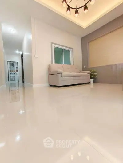Spacious modern living room with elegant lighting and sleek flooring