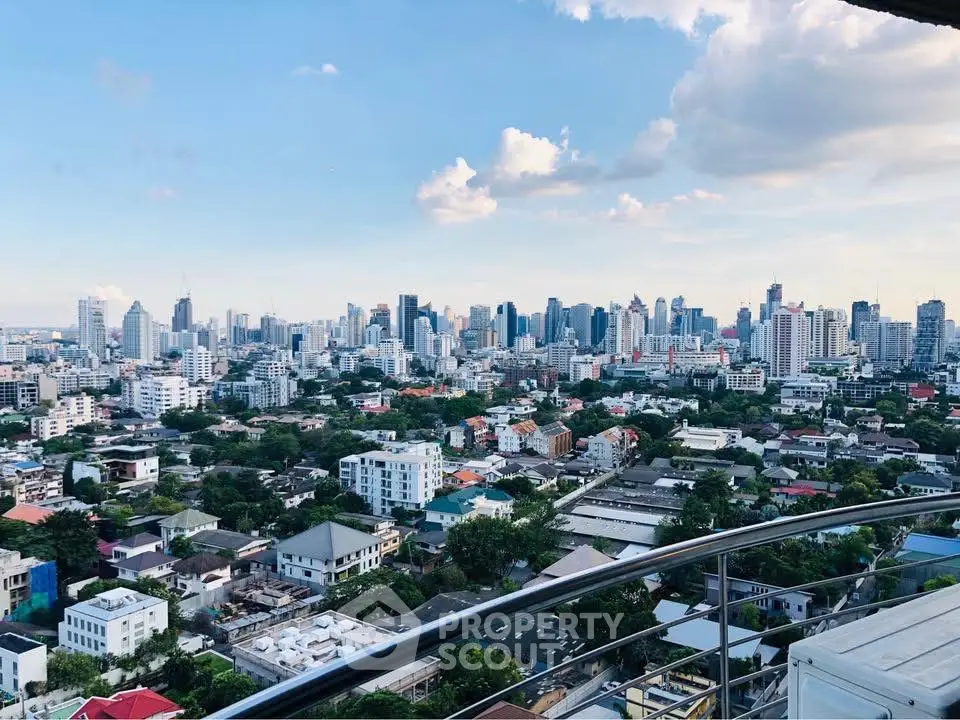 Stunning city skyline view from a high-rise balcony, showcasing urban living at its finest.