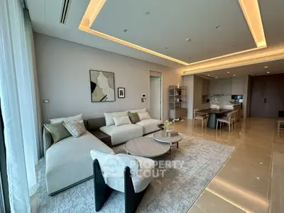 Luxurious open-plan living room with modern furniture and elegant lighting