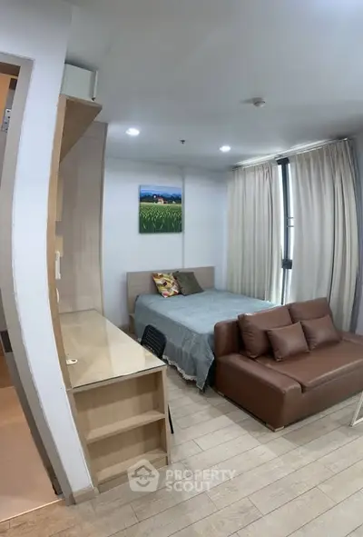 Cozy studio apartment with modern furnishings and natural light