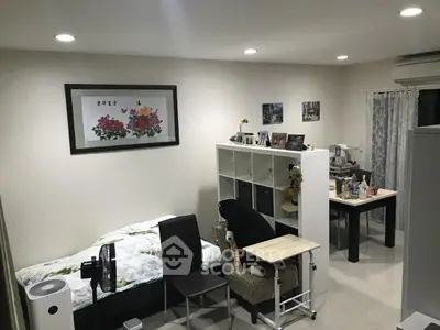 Cozy bedroom with modern decor and multifunctional furniture setup