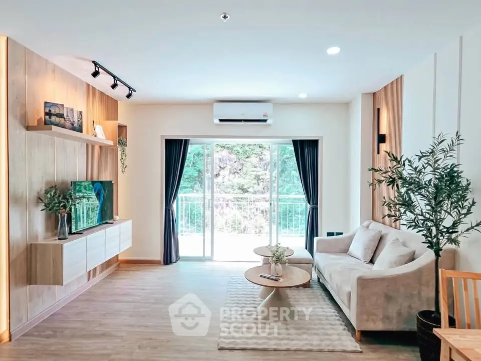 Modern living room with stylish decor and large window view