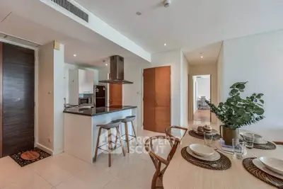 Modern open-plan kitchen and dining area with stylish decor and natural light.