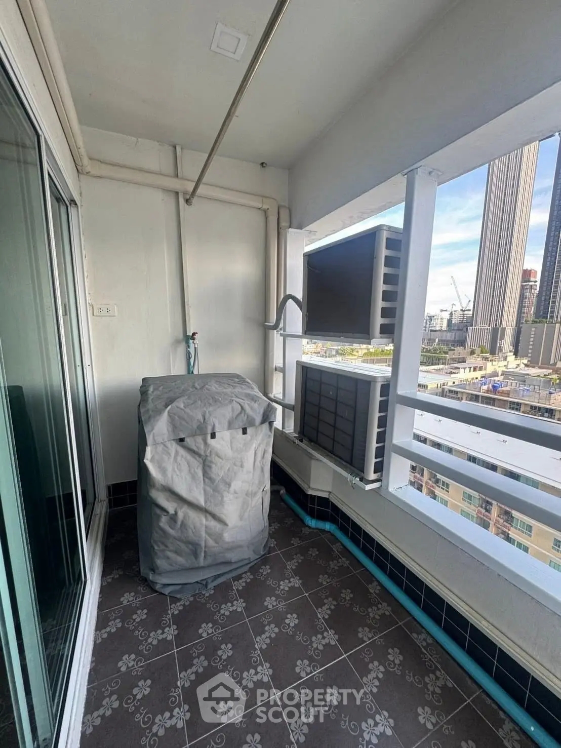 Charming balcony with city view, perfect for relaxation and enjoying the skyline.