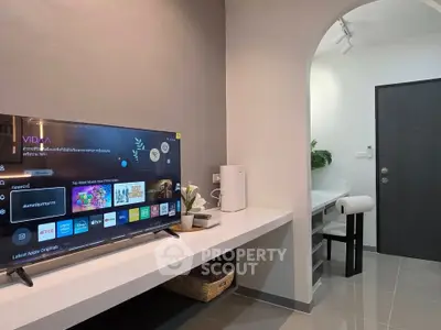 Modern living room with sleek TV setup and stylish decor