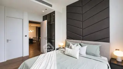 Luxurious modern bedroom with elegant decor and soft lighting, perfect for relaxation and comfort.