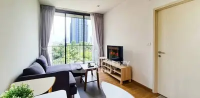 Modern living room with city view and cozy furnishings