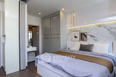 Luxurious modern bedroom with elegant decor and marble accents