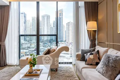 Luxurious living room with city skyline view, elegant decor, and cozy seating area.