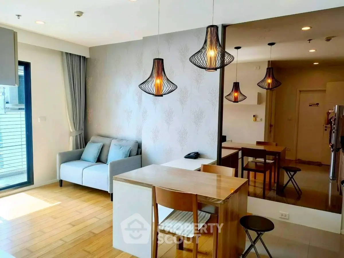Modern living room with stylish lighting and cozy seating area