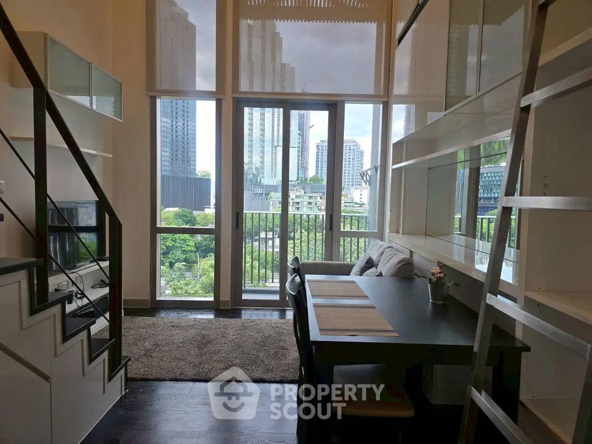 Modern loft apartment with large windows and city view