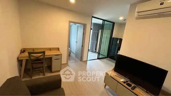 Modern living room with sleek furniture and air conditioning in a cozy apartment.