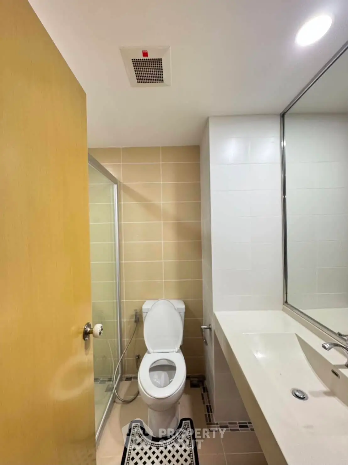Modern bathroom with sleek fixtures and a spacious shower area.