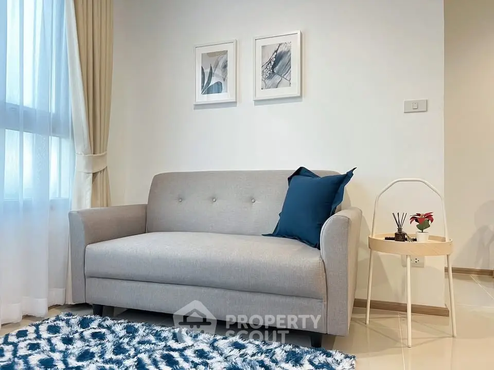 Cozy living room with modern gray sofa and stylish decor accents.