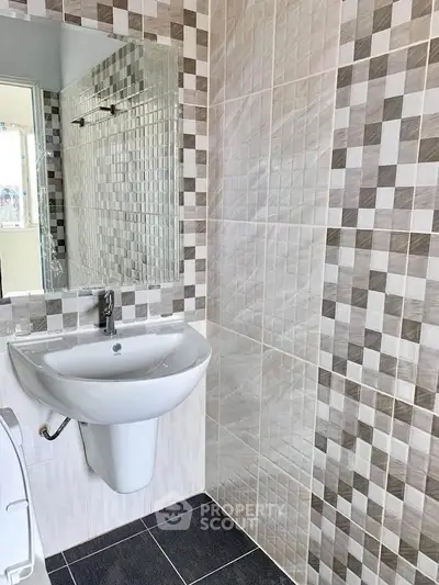 Modern bathroom with stylish tile design and sleek fixtures