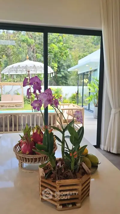 Luxurious kitchen with tropical garden view and elegant decor