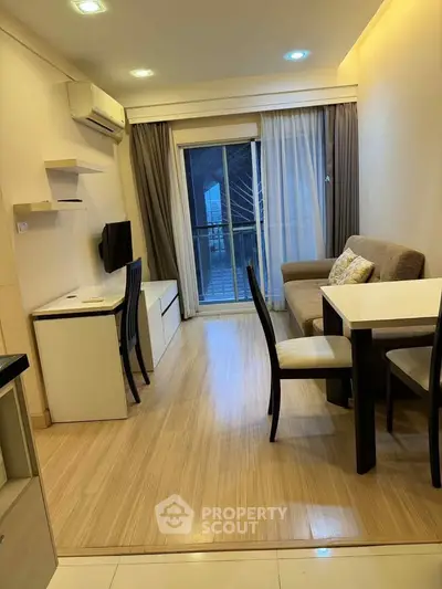 Modern living room with balcony access and stylish furniture