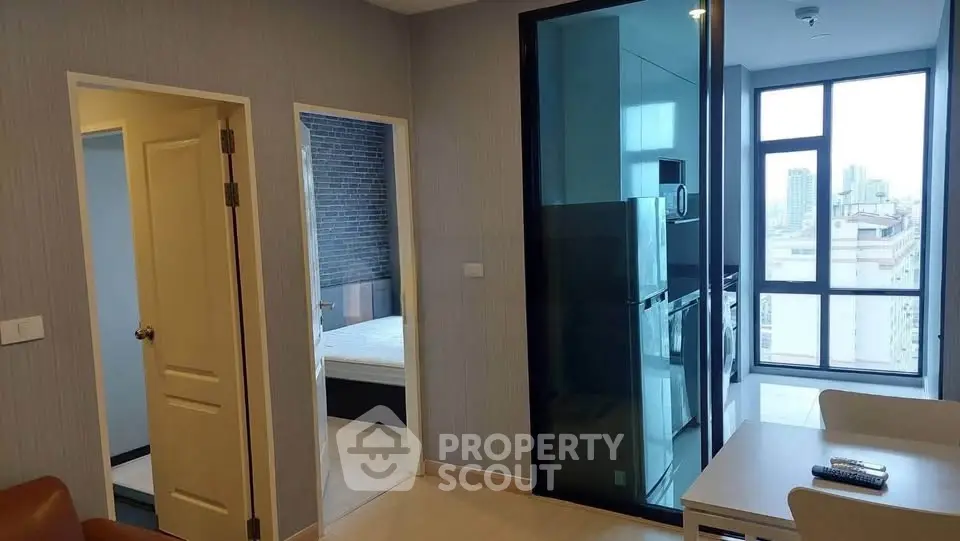 Modern apartment interior with open kitchen and city view