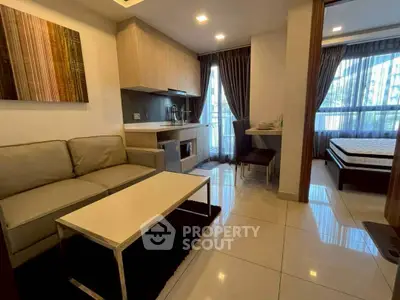 Modern studio apartment with cozy living area and stylish kitchen