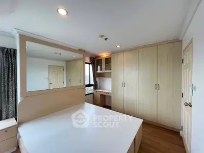 Spacious bedroom with built-in wardrobes and modern design