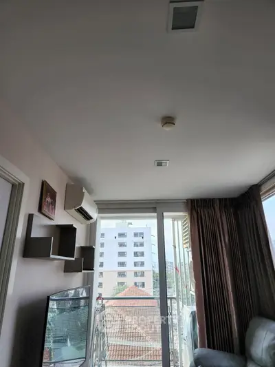 Modern living room with balcony view in urban apartment
