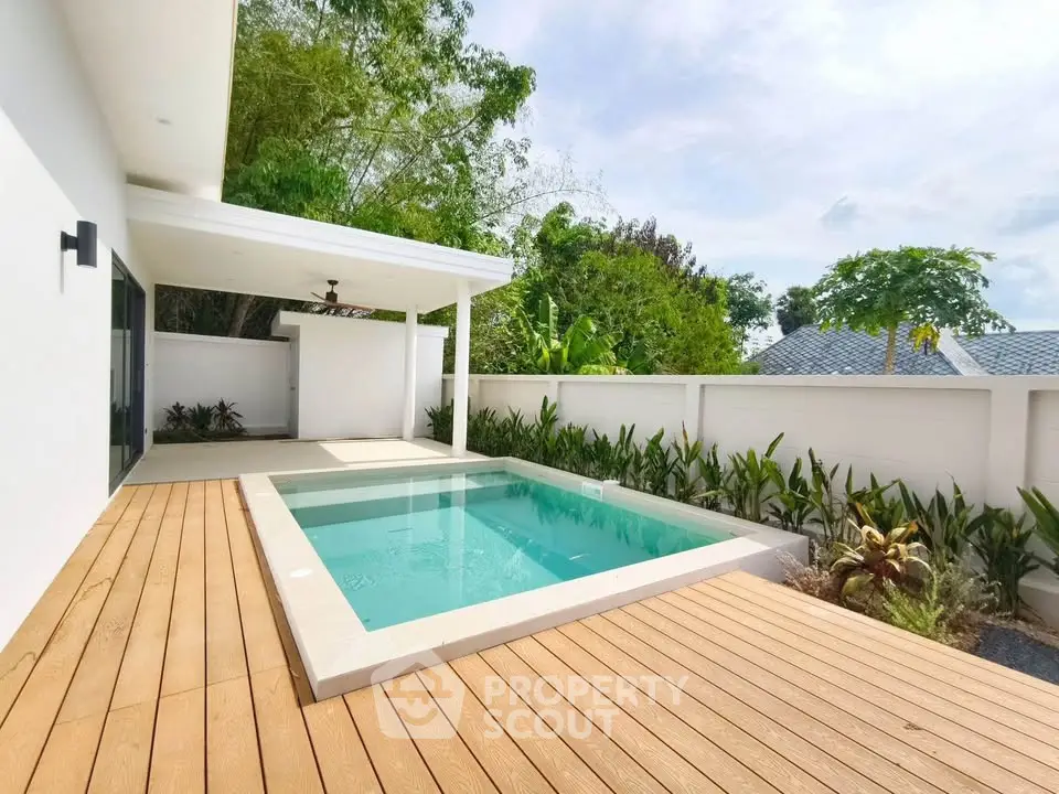 Luxurious modern home with private pool and spacious deck, perfect for relaxation and entertainment.