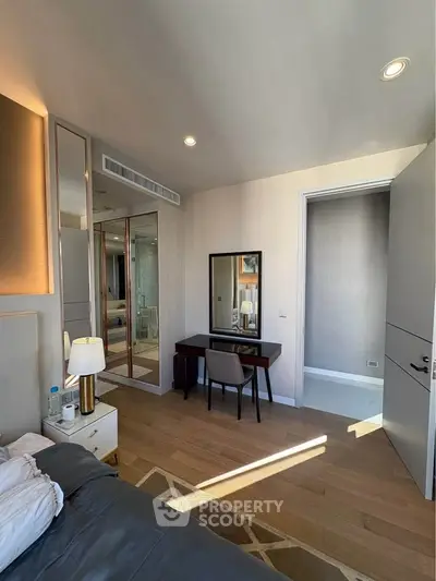 Modern bedroom with stylish decor and natural light