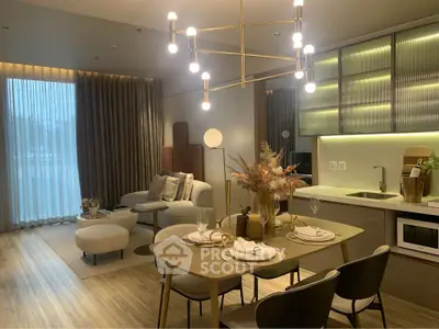 Modern open-plan living room and kitchen with elegant lighting and stylish decor