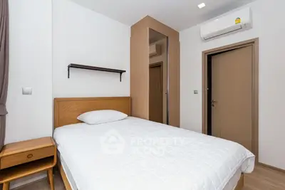 Cozy modern bedroom with air conditioning and minimalist design