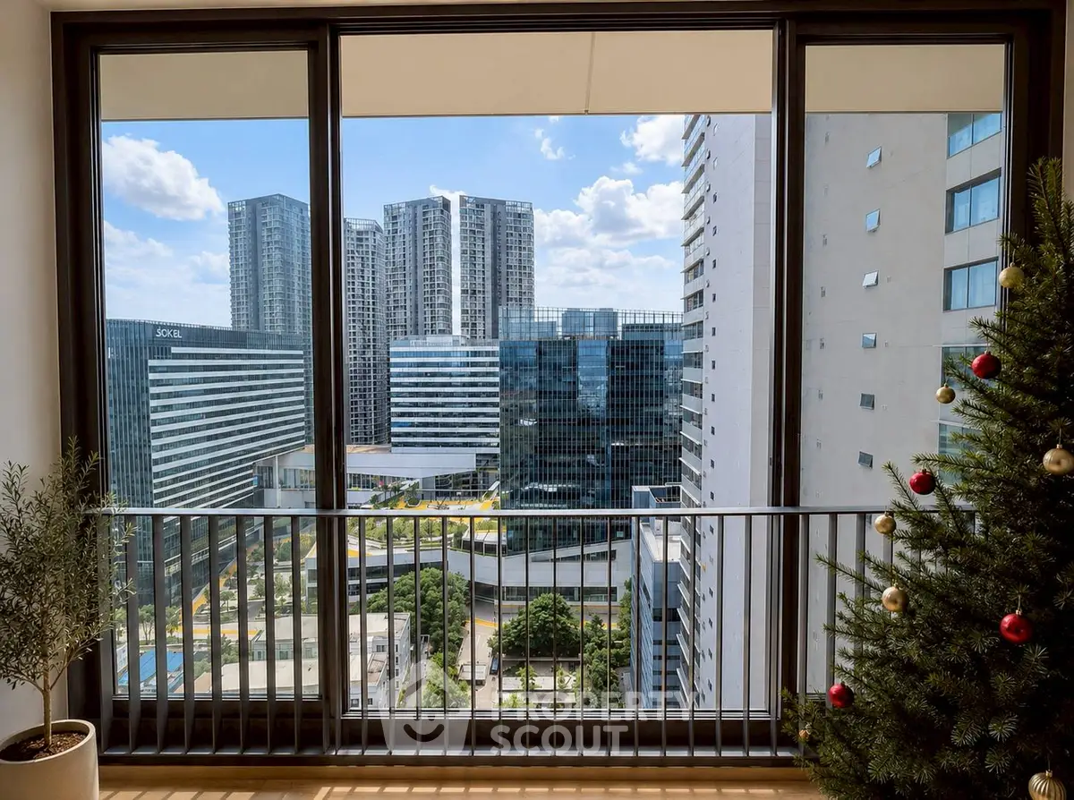 Stunning city view from modern apartment balcony with festive decor.