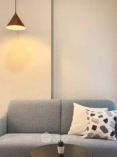 Cozy living room with modern sofa and stylish lighting