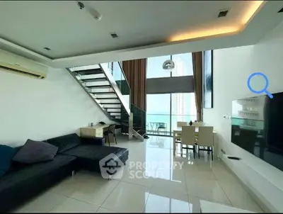 Modern living room with sleek staircase and city view balcony