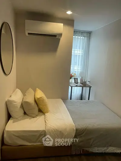 Cozy bedroom with modern air conditioning and natural light