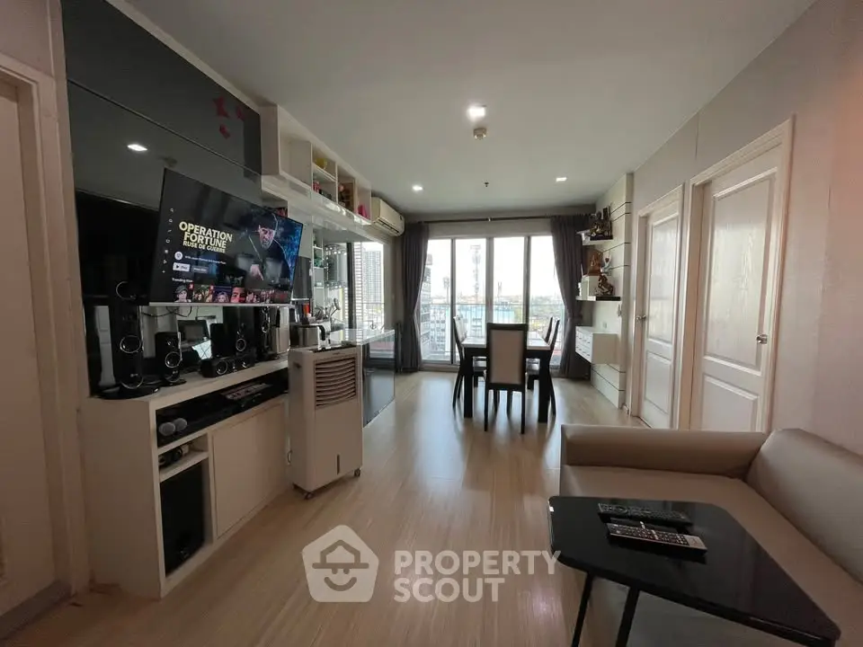 Modern living room with open layout and balcony view in stylish apartment
