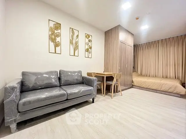 Modern studio apartment with stylish decor and cozy furnishings, perfect for urban living.