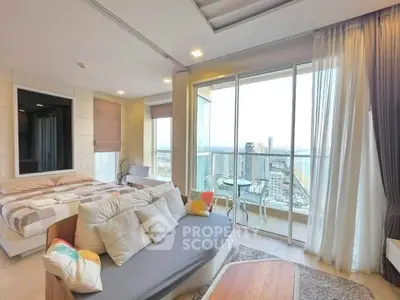 Luxurious bedroom with stunning city view and spacious balcony in modern high-rise apartment.