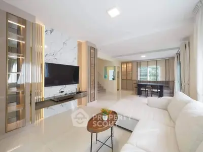 Luxurious modern living room with marble accent wall and spacious seating area