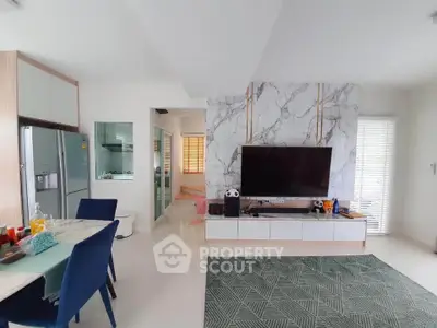 Modern living room with marble accent wall and sleek furniture