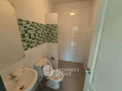 Modern bathroom with stylish tile accents and contemporary fixtures.