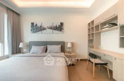 Modern bedroom with stylish decor and built-in study area, perfect for urban living.