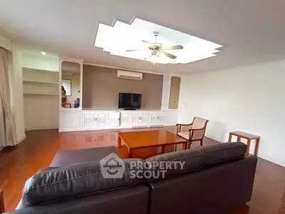 Spacious living room with elegant ceiling design and modern furniture