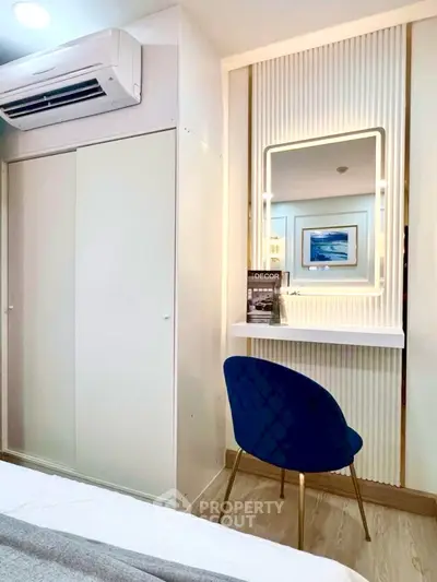 Stylish bedroom with modern decor and elegant vanity area