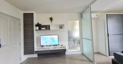 Modern living room with sleek TV setup and stylish decor