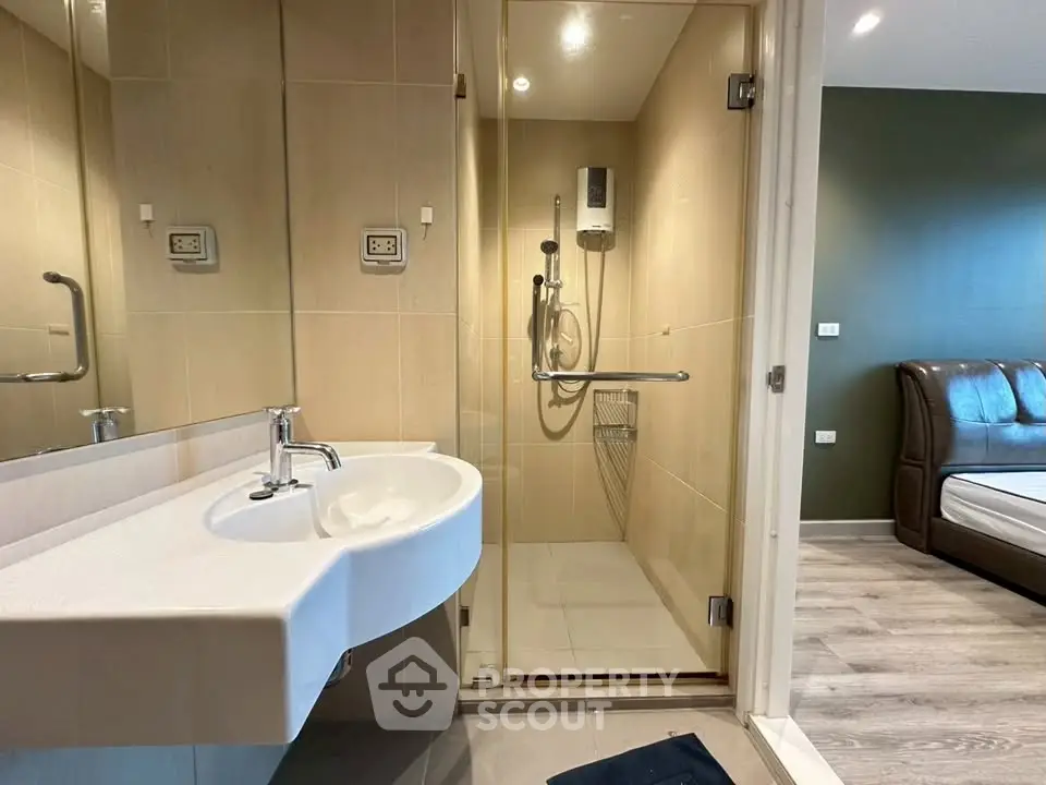 Modern bathroom with glass shower and sleek sink design