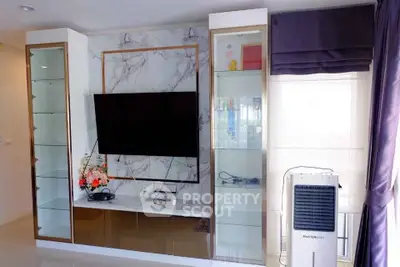 Modern living room with stylish TV unit and air conditioner