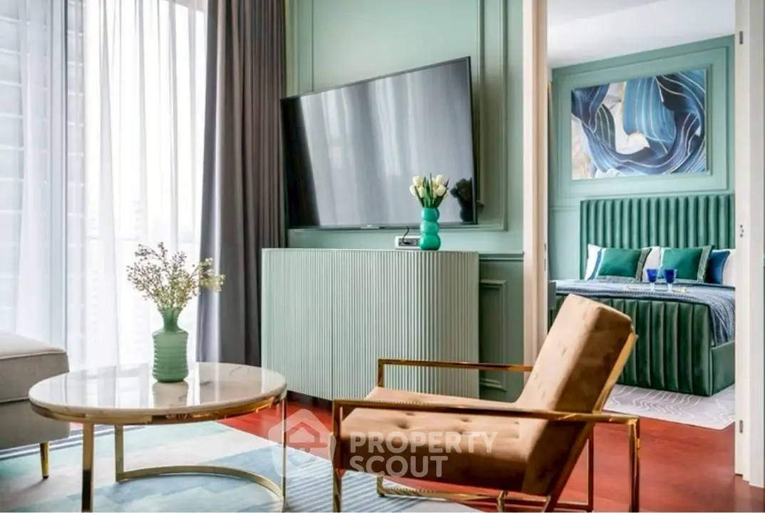 Stylish modern living room with elegant decor and a glimpse of a luxurious bedroom.